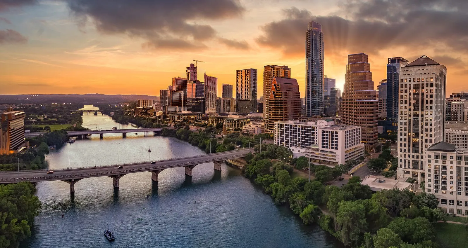 Downtown Austin, Texas skyline over Lady Bird Lake at sunset